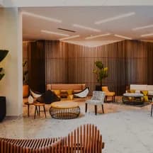 Illustrative photo: a hotel lounge with warm wood finishes